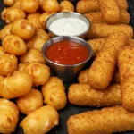 Fried cheese curds and mozzarella sticks served with dipping sauces