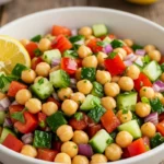 Bowl of Mediterranean chickpea salad with lemon dressing